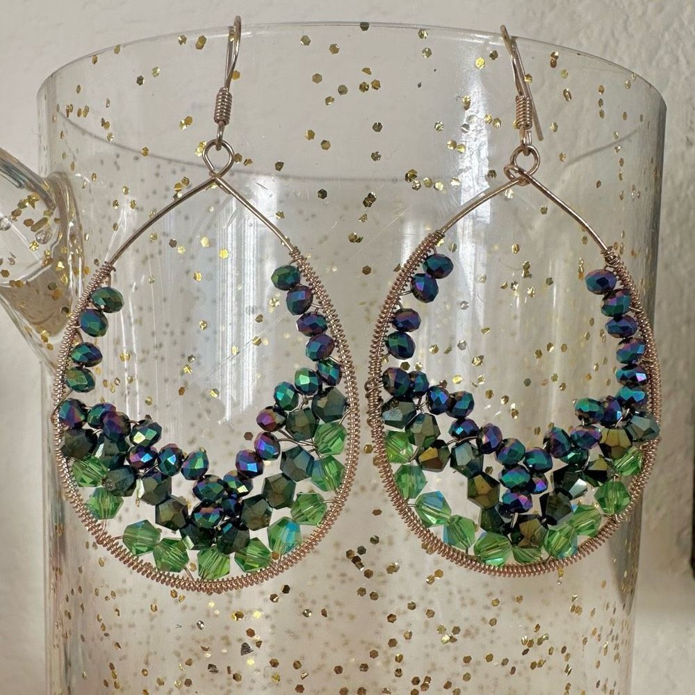Gold tone green teardrop earrings